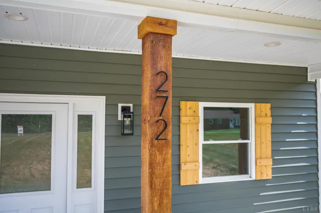 an empty room with window and wooden floor