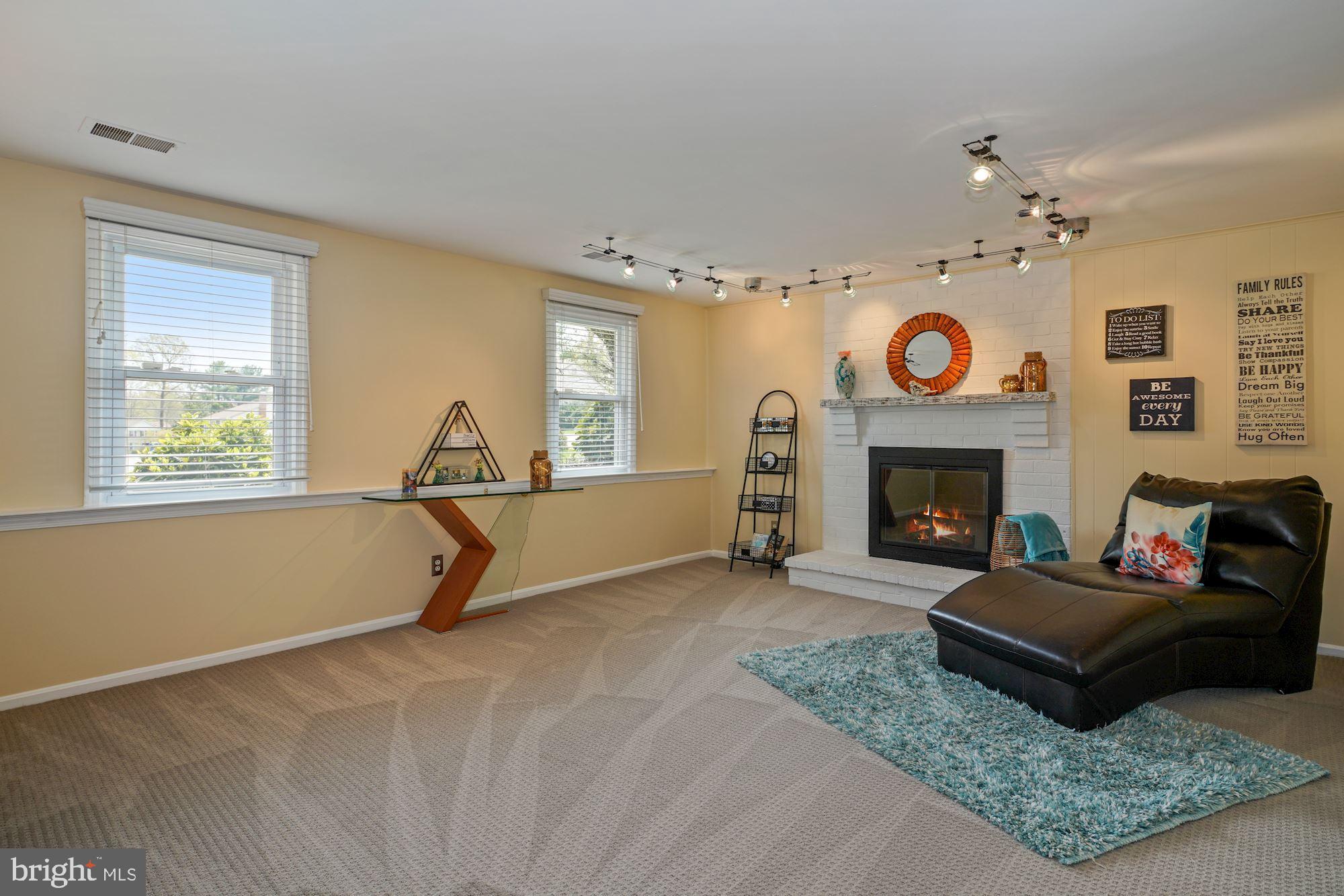 8112 Viola Street Springfield, VA 22152 - Photo 16 of 28 Lower level family room w/fireplace