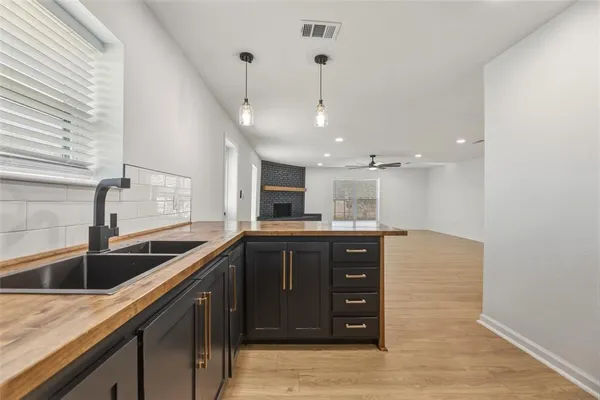 a kitchen with a sink and cabinets