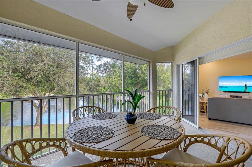 1240 Shady Rest Lane, Unit 102 Naples, FL 34103 - Photo 20 of 23 a view of a dining room with furniture window and outside view