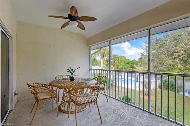 a dining room with furniture window and outside view