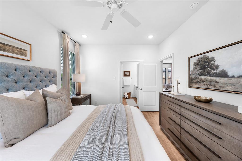 6415 Fm 1570 Street West, Unit 116 Greenville, TX 75402 - Photo 21 of 34 a spacious bedroom with a bed and a flat screen tv