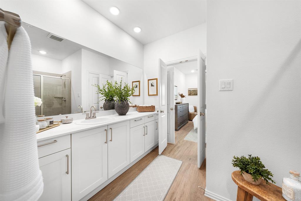 6415 Fm 1570 Street West, Unit 116 Greenville, TX 75402 - Photo 25 of 34 a en suite bathroom with a double vanity sink and mirror