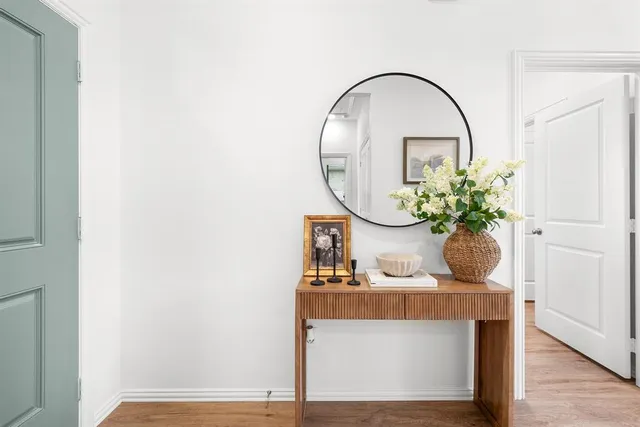 a room with table and flowerpot