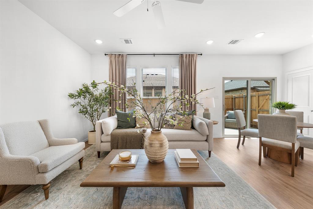 6415 Fm 1570 Street West, Unit 116 Greenville, TX 75402 - Photo 7 of 34 a living room with furniture and a large window