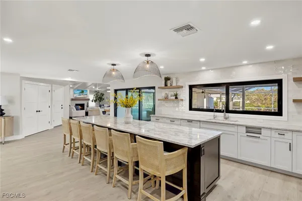 a kitchen with a counter space and wooden floor
