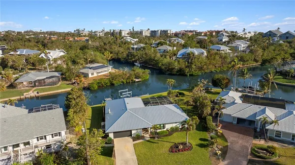 an aerial view of a house with a ocean view