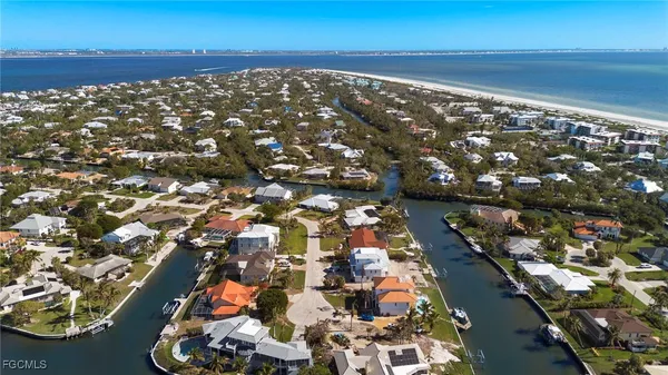 an aerial view of beach and ocean