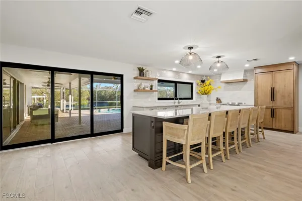 a kitchen with stainless steel appliances granite countertop counter space a sink and cabinets