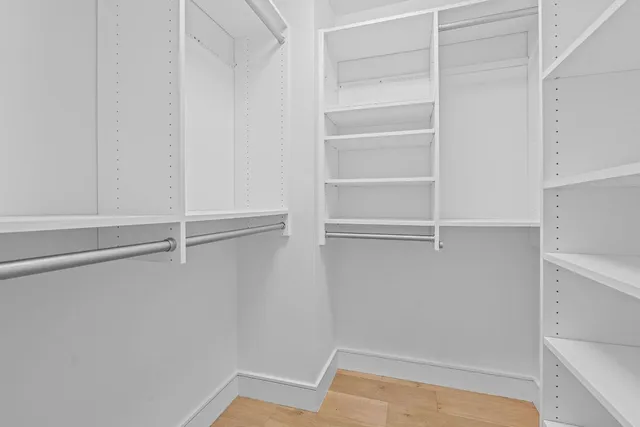a view of an empty walk in closet
