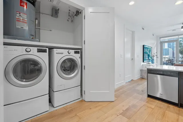 a utility room with sink dryer and washer