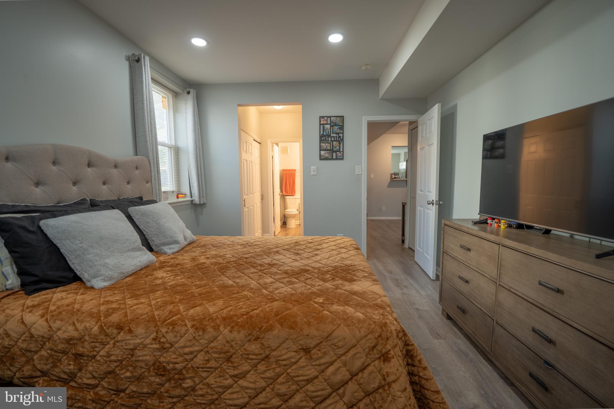 15 Pickering Court, Unit 1502 Germantown, MD 20874 - Photo 12 of 17 a bedroom with a bed and a flat screen tv