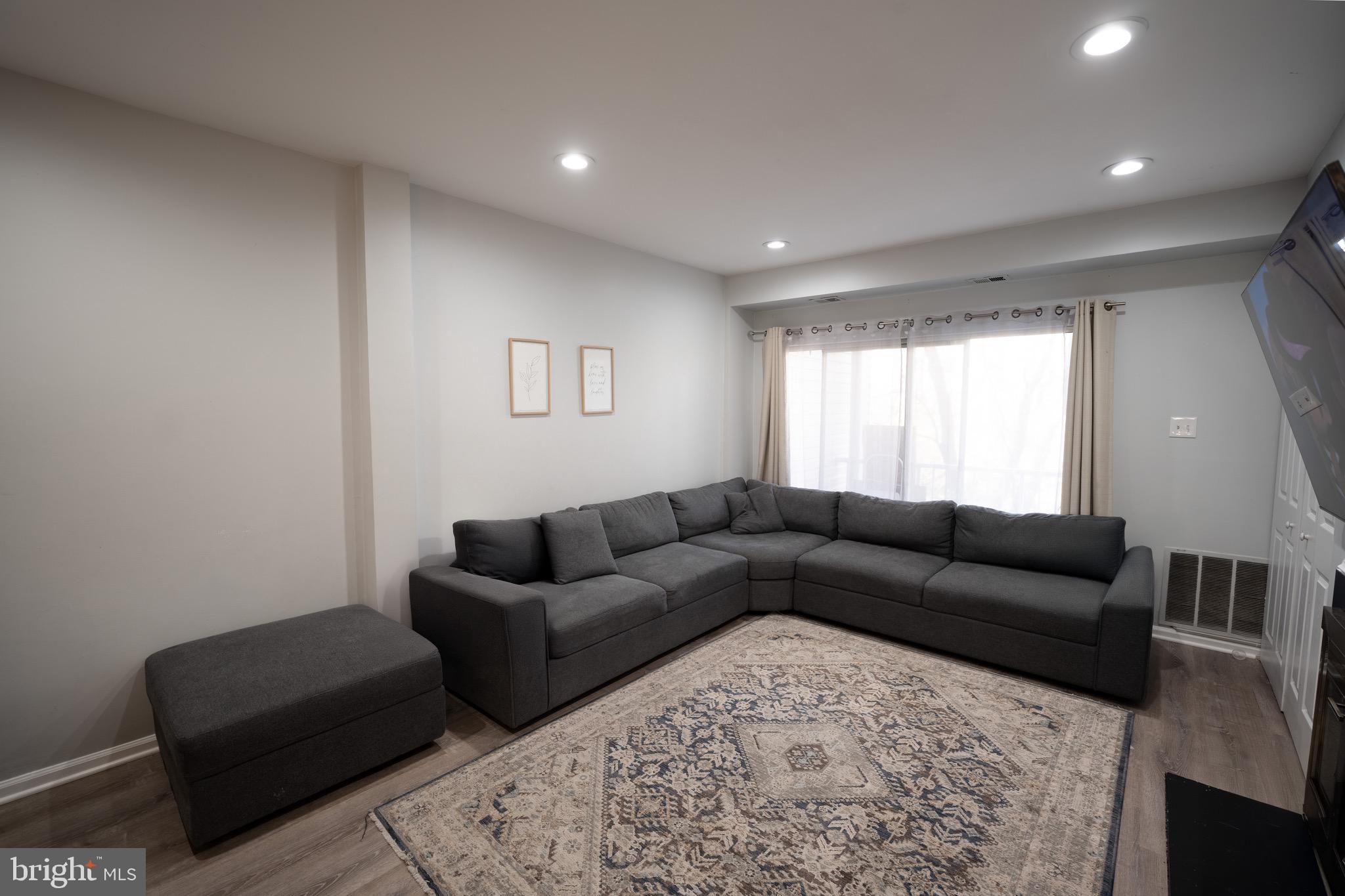 15 Pickering Court, Unit 1502 Germantown, MD 20874 - Photo 3 of 17 a living room with furniture and a couch