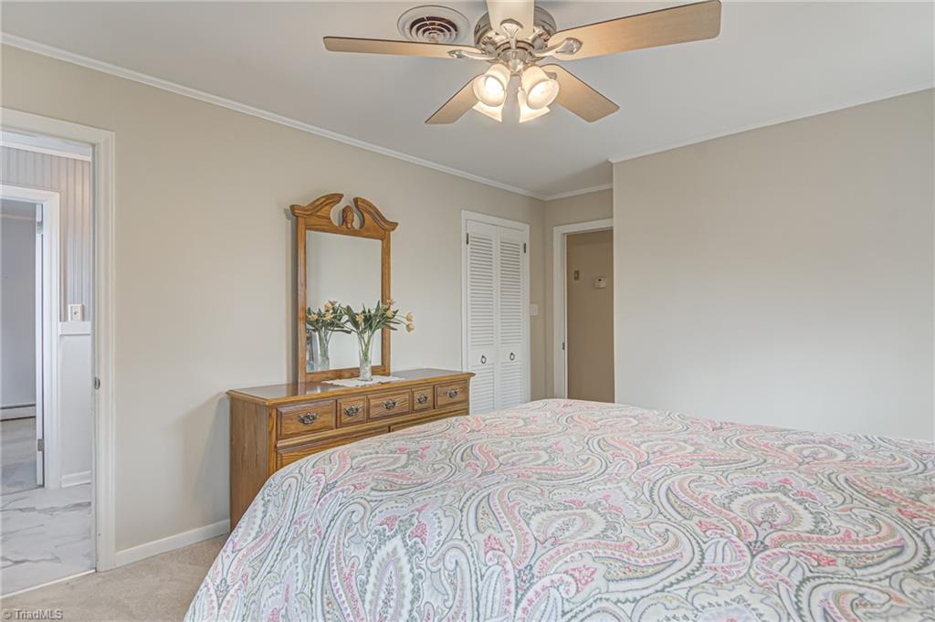 305 Pine Ridge Drive High Point, NC 27262 - Photo 16 of 35 Primary bedroom also feature walk-in closet and en suite full bathroom.