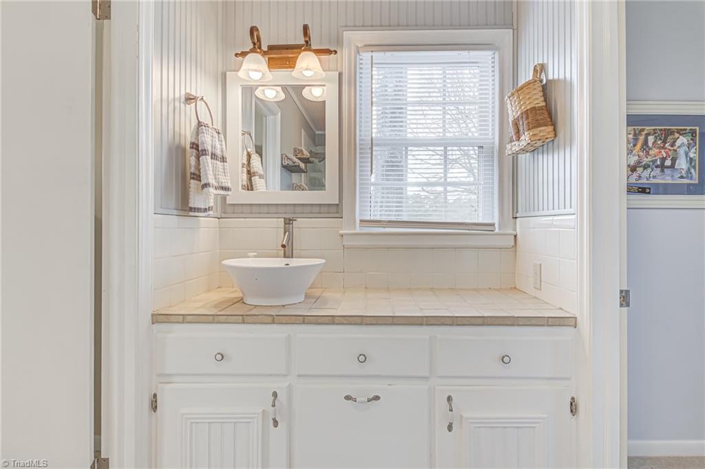 305 Pine Ridge Drive High Point, NC 27262 - Photo 17 of 35 Primary en suite full bathroom with sink vanity.