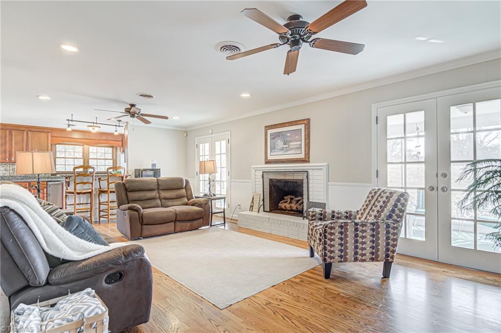 305 Pine Ridge Drive High Point, NC 27262 - Photo 6 of 35 This large cozy den also offers fireplace. French door leads to rear screen porch.