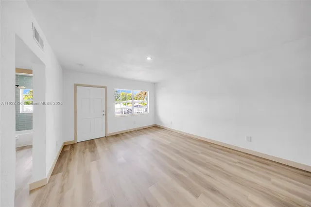 a view of an empty room and window