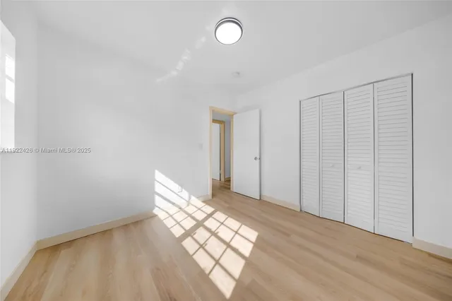 a view of an empty room and window