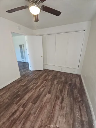 a view of room with wooden floor