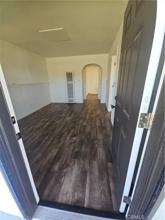 a bedroom with a bed and a mirror