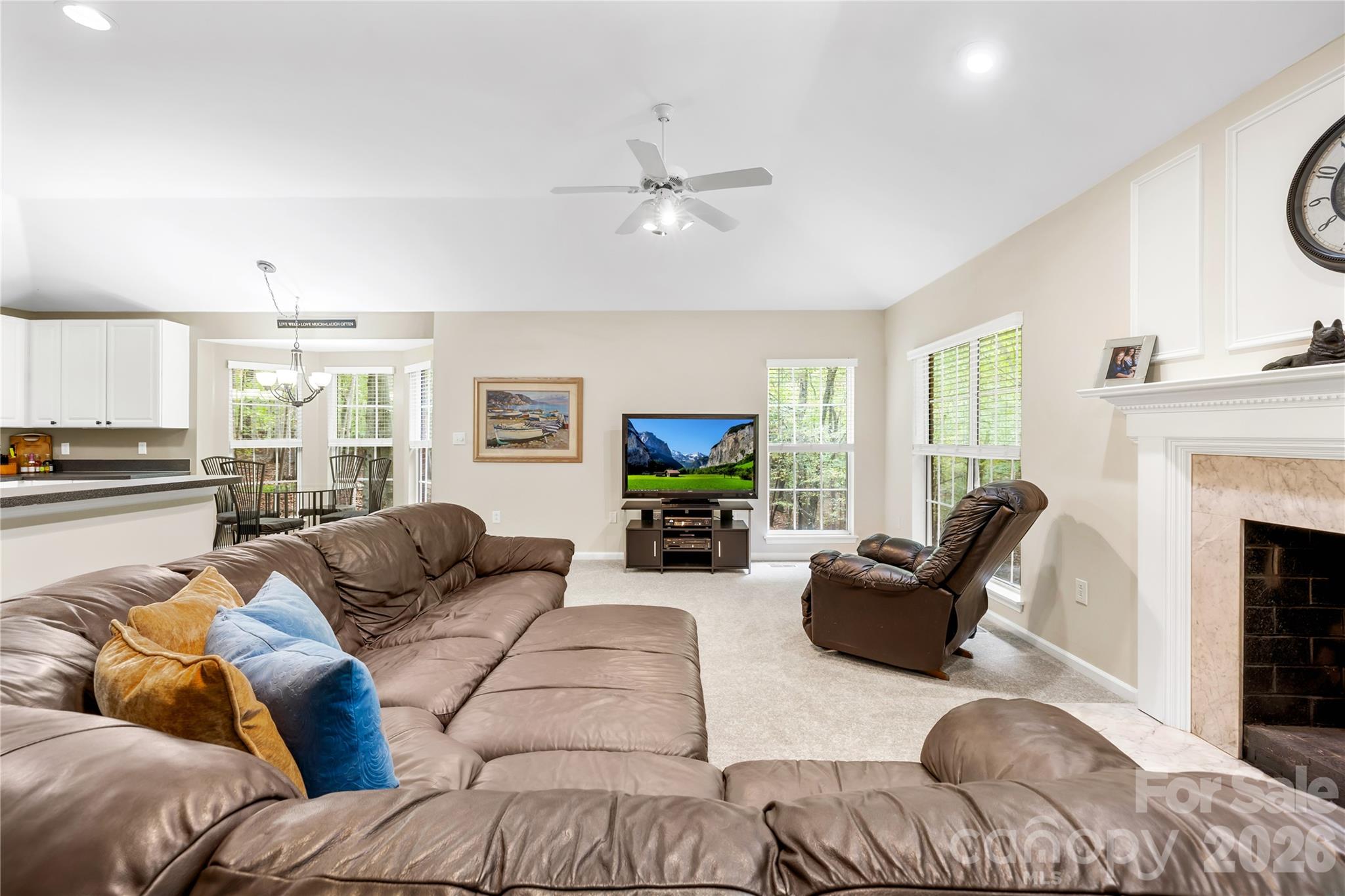 11113 Asbury Chapel Road Huntersville, NC 28078 - Photo 16 of 43 a living room with furniture fireplace and a large window