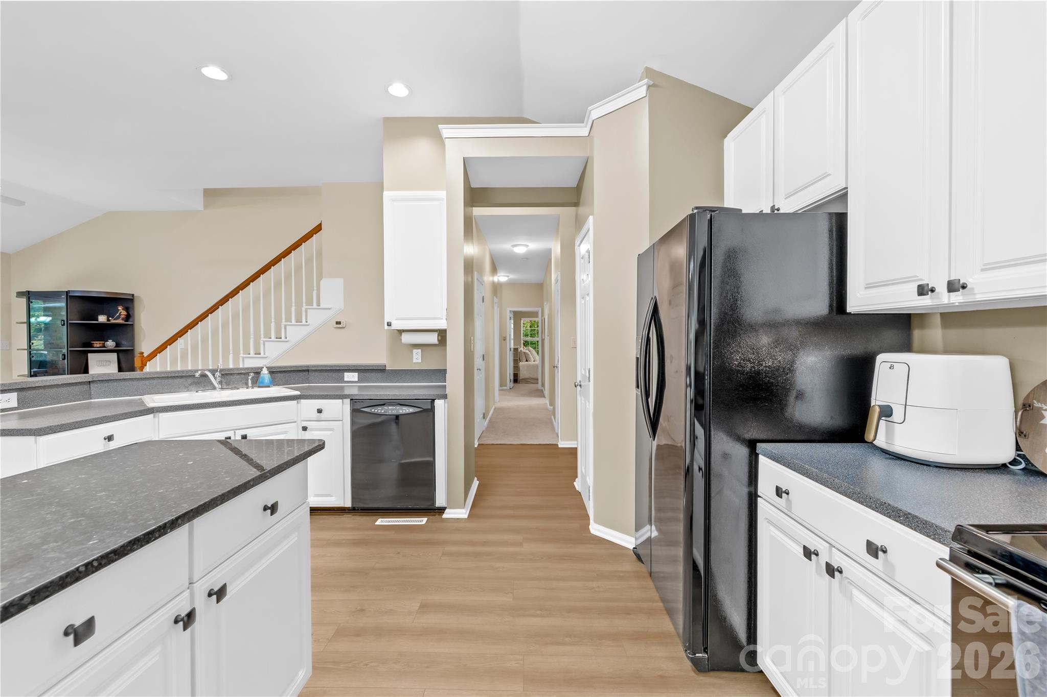 11113 Asbury Chapel Road Huntersville, NC 28078 - Photo 23 of 43 a kitchen with a refrigerator and a sink