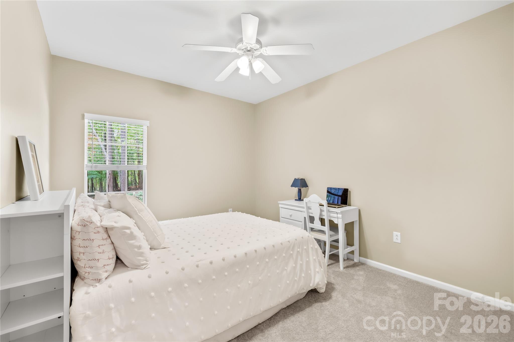 11113 Asbury Chapel Road Huntersville, NC 28078 - Photo 36 of 43 a bedroom with a bed and a chandelier