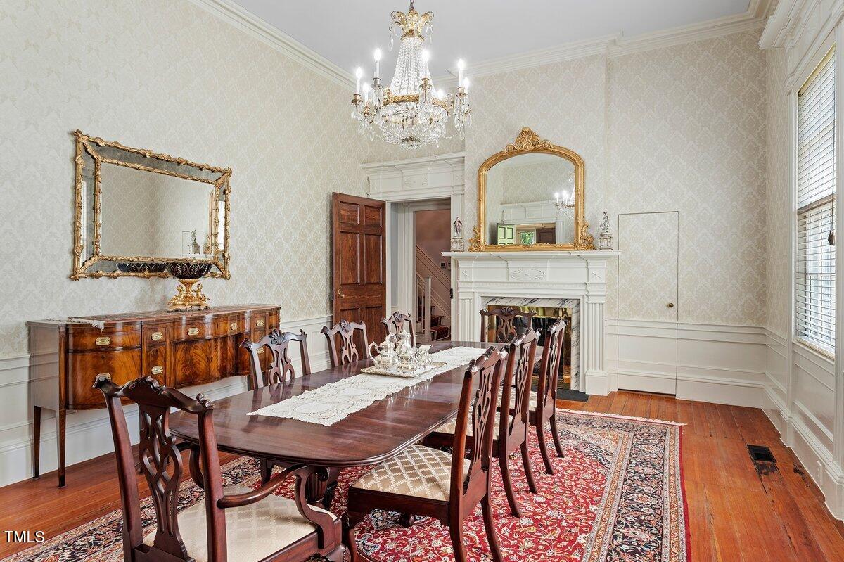 206 Shaver Road Macon, NC 27551 - Photo 21 of 68 a view of a dining room with furniture window and wooden floor