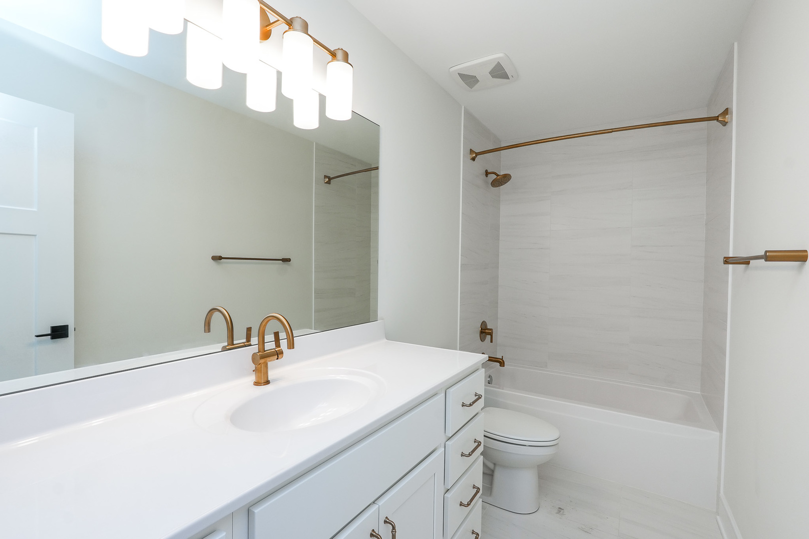 1009 Spring Street Manteno, IL 60950 - Photo 13 of 36 a bathroom with a sink a toilet and shower