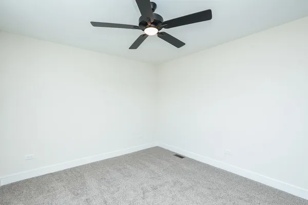 a kitchen with stainless steel appliances granite countertop a dining table chairs refrigerator sink and cabinets