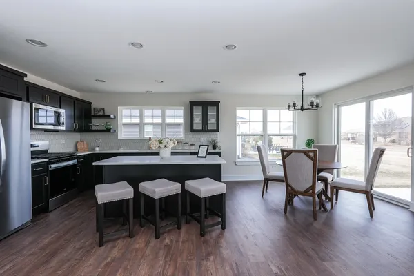 a kitchen with a sink cabinets and window