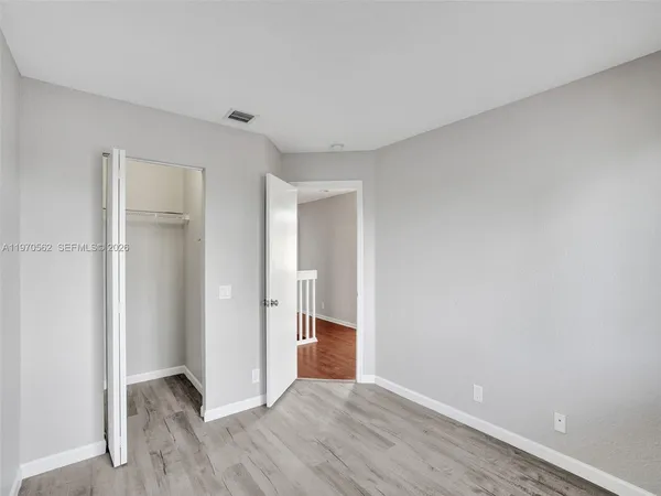 a view of entryway with wooden floor