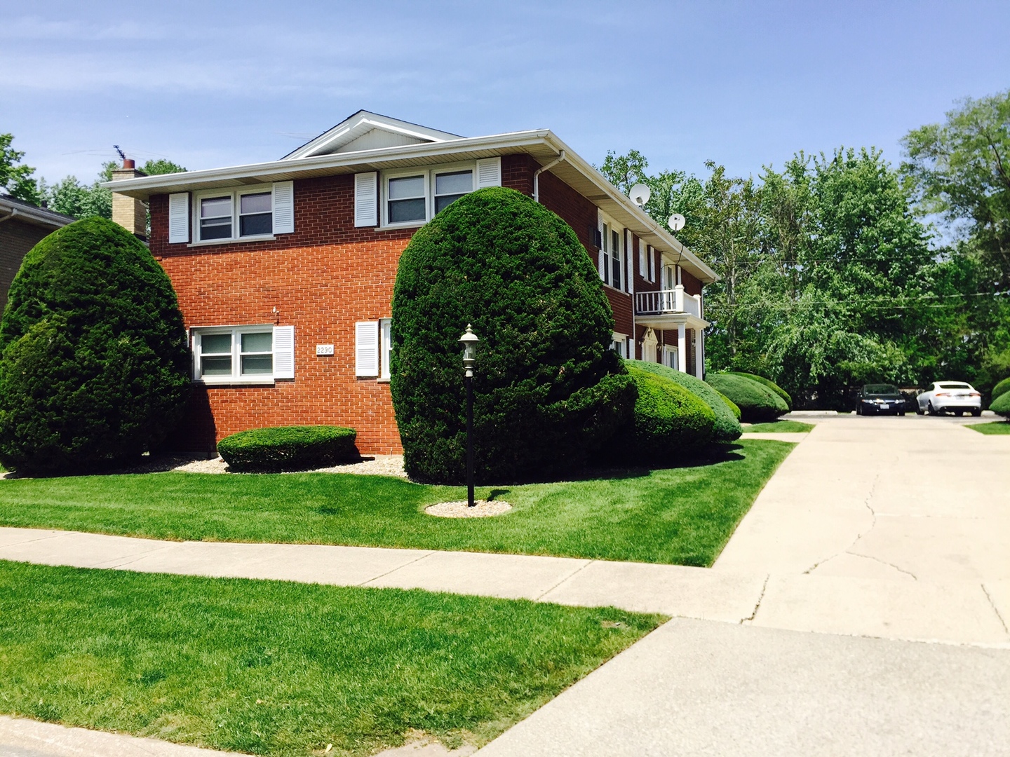 2290 182nd Place Lansing, IL 60438 - Photo 1 of 16 a front view of a house with a garden