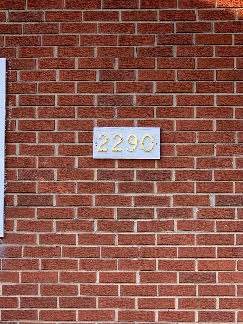 2290 182nd Place Lansing, IL 60438 - Photo 2 of 16 a street sign on a brick wall