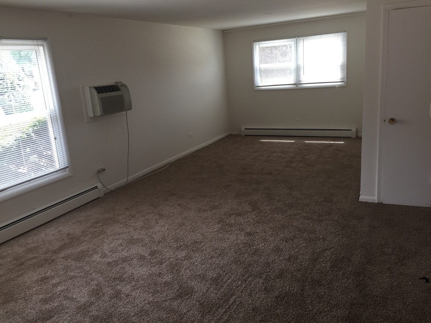 2290 182nd Place Lansing, IL 60438 - Photo 11 of 16 a view of an empty room and a window