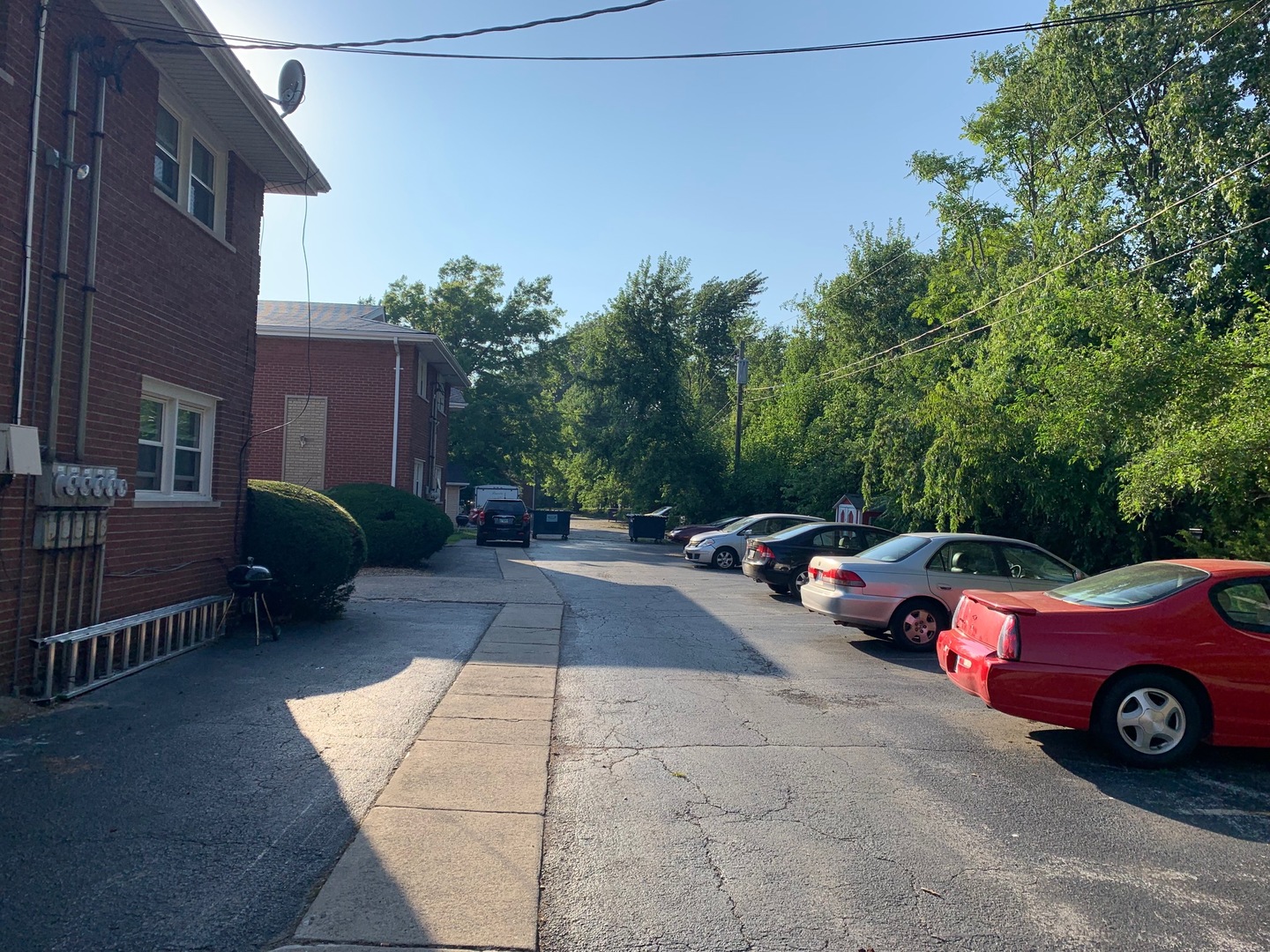 2290 182nd Place Lansing, IL 60438 - Photo 4 of 16 a view of a cars park in front of a building