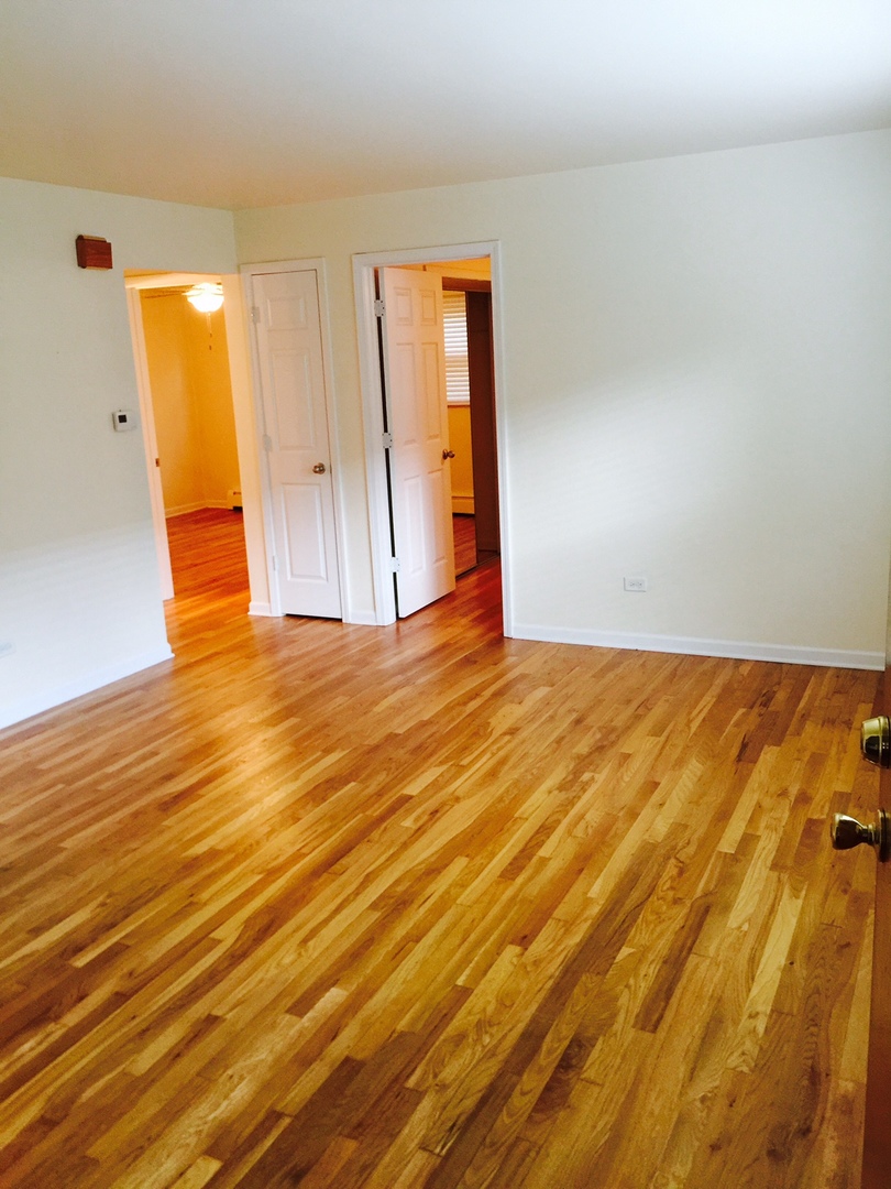 2290 182nd Place Lansing, IL 60438 - Photo 9 of 16 a view of empty room with wooden floor