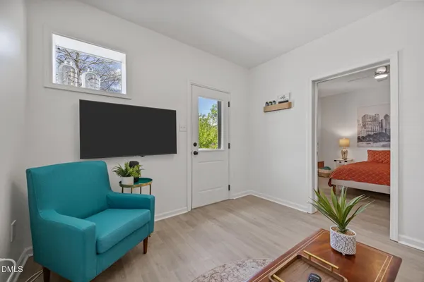 a dining room with furniture and window