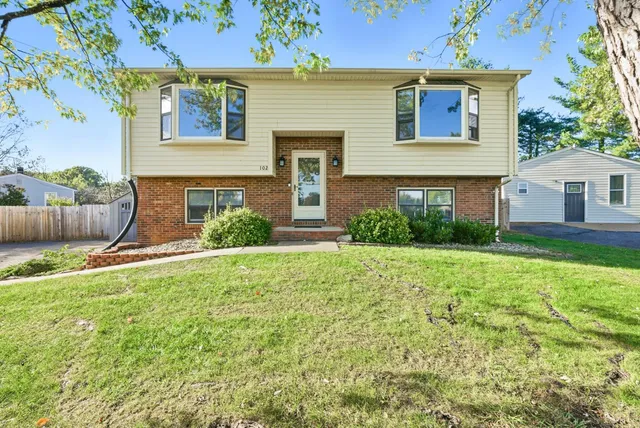 front view of a house with a yard