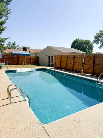 a view of swimming pool with seating area