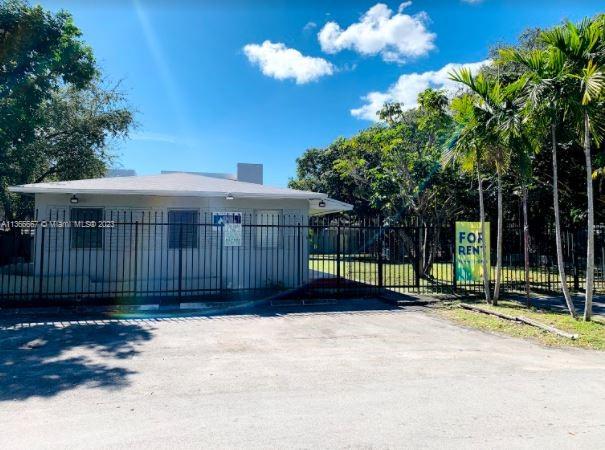738 Northeast 86th Street, Unit 8 Miami, FL 33138 - Photo 1 of 10 a view of a house with a backyard