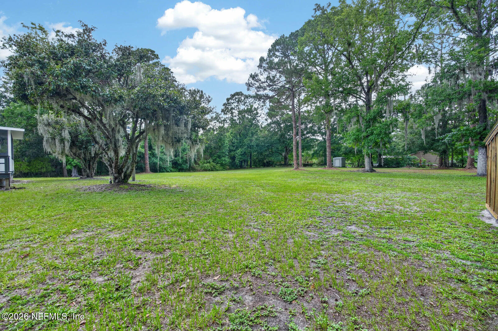 1950 Lightsey Road St. Augustine, FL 32084 - Photo 34 of 57 a view of a grassy field with trees