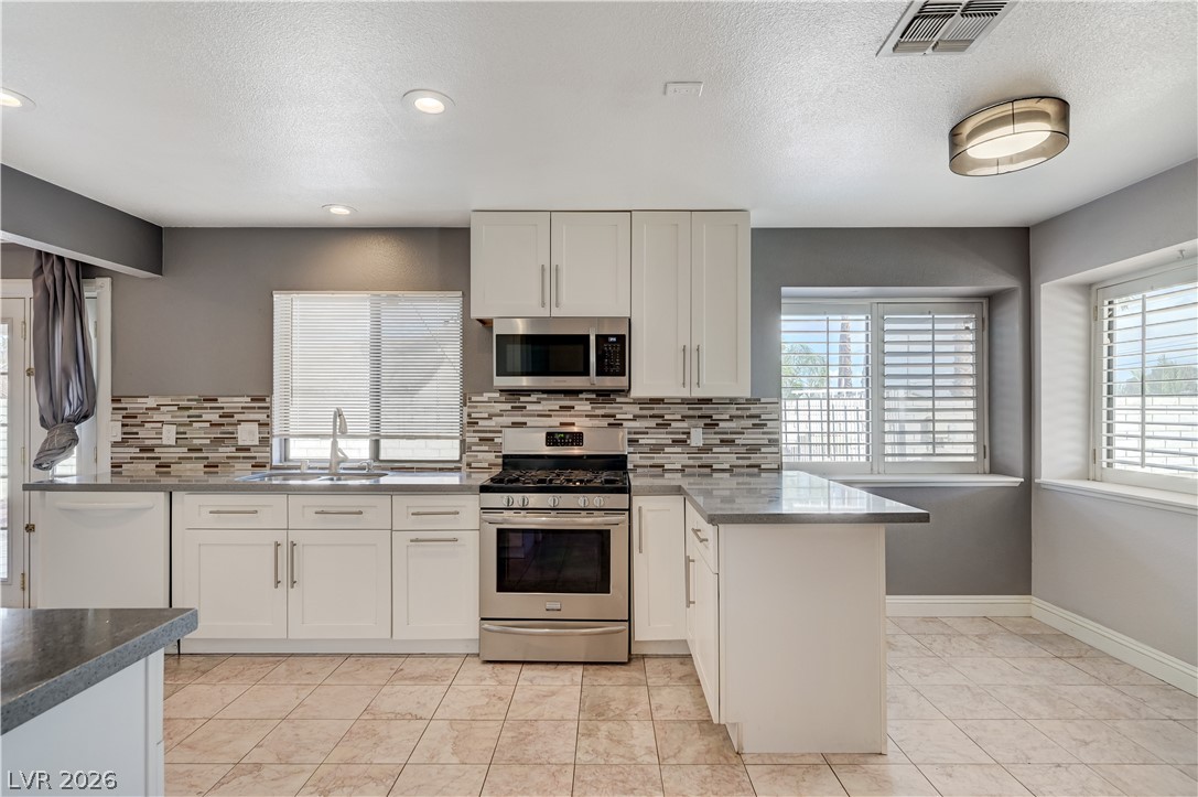 6635 Costa Brava Road Las Vegas, NV 89146 - Photo 12 of 59 A streamlined kitchen design offers plentiful counter space and integrated appliances.