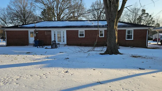 a front view of a house with yard