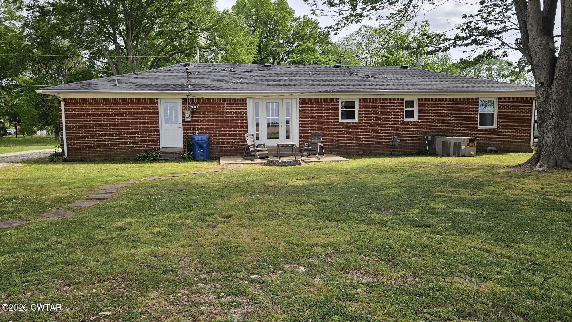516 West Knox Street Rutherford, TN 38369 - Photo 19 of 19 a backyard of a house with yard and outdoor seating