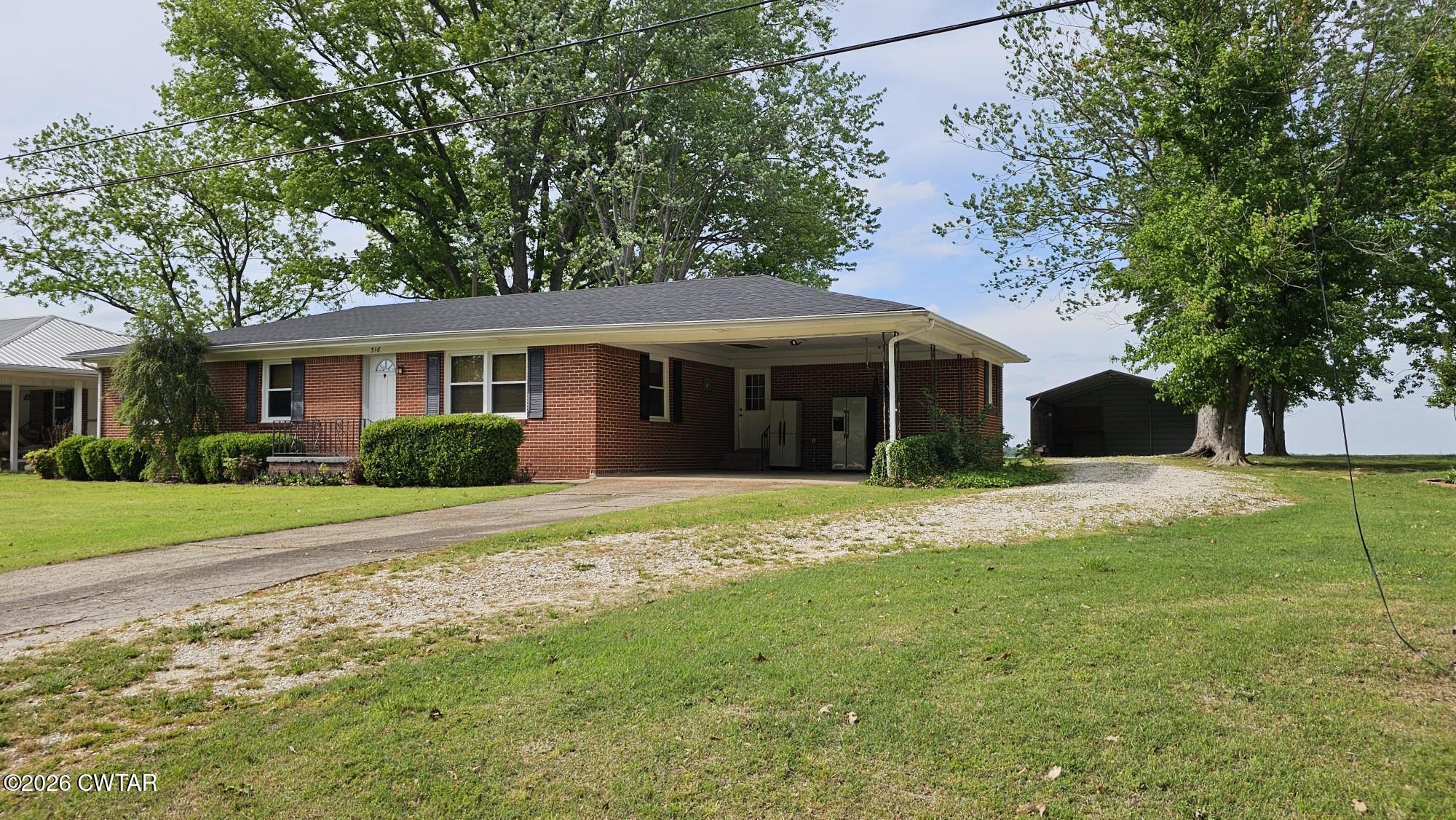 516 West Knox Street Rutherford, TN 38369 - Photo 3 of 19 a front view of a house with a yard