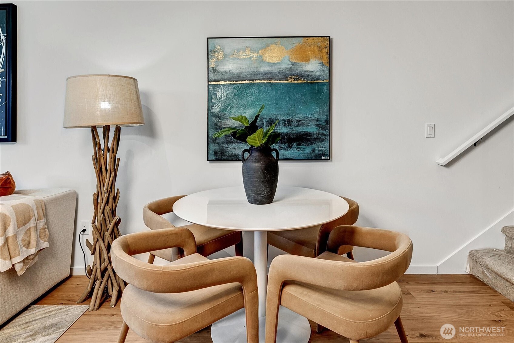 1227 East Roy Street Seattle, WA 98102 - Photo 13 of 35 a dining room with furniture and a potted plant