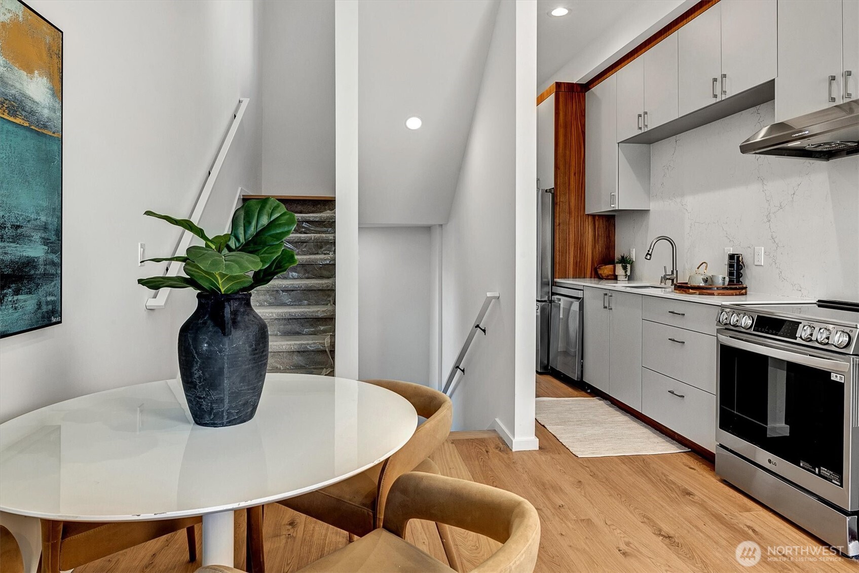 1227 East Roy Street Seattle, WA 98102 - Photo 14 of 35 a close view of dining table chairs and potted plant