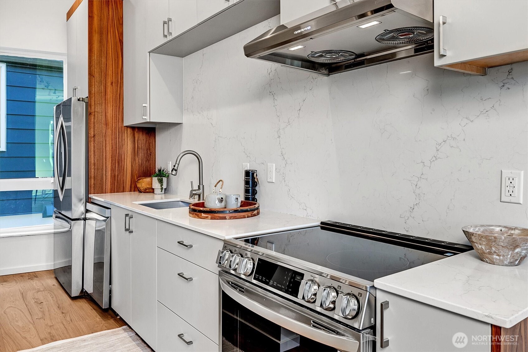 1227 East Roy Street Seattle, WA 98102 - Photo 15 of 35 a kitchen with a stove and a sink