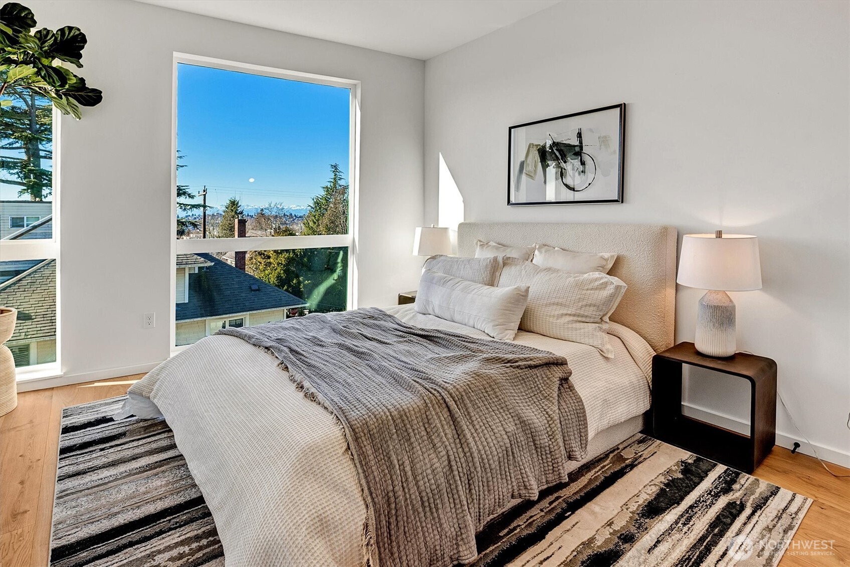 1227 East Roy Street Seattle, WA 98102 - Photo 19 of 35 a bedroom with a bed and a window